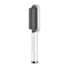 Brosse lissante à ions négatifs avec peigne chauffant