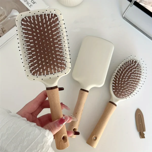 Peigne de massage à coussin d'air