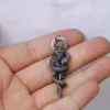 Collier pendentif fleur et serpent en acier